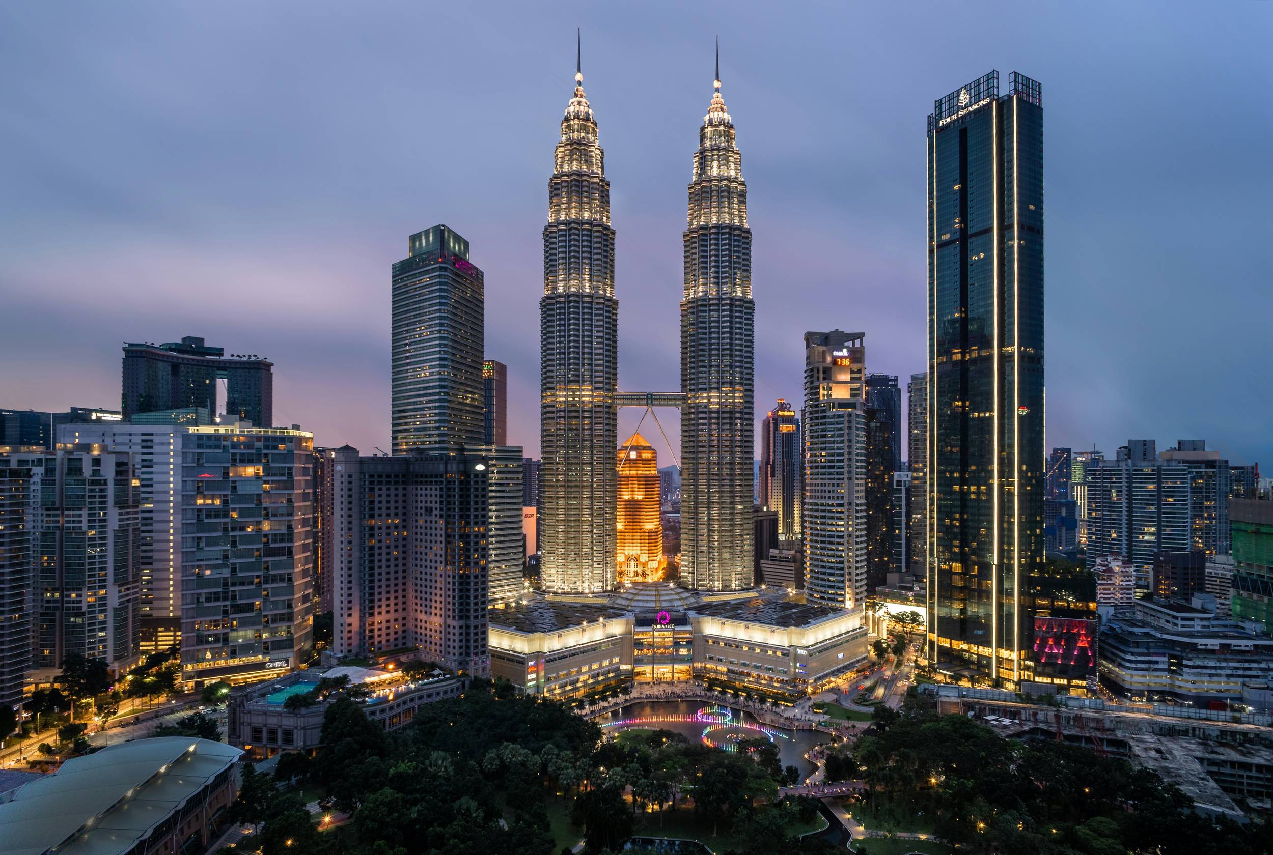 Illuminated Petronas Twin Towers and City Lights in Kuala Lumpur, Malaysia